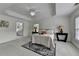 Spacious bedroom with tray ceiling, carpet flooring, two windows and stylish lamps at 3120 Caney Creek Ln, Cumming, GA 30041