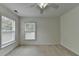 This bedroom features a ceiling fan, one window, and light colored walls at 3120 Caney Creek Ln, Cumming, GA 30041