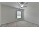 This bedroom features a ceiling fan, one window, and light colored walls at 3120 Caney Creek Ln, Cumming, GA 30041