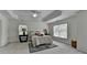 Spacious bedroom with tray ceiling, carpet flooring, two windows and stylish lamps at 3120 Caney Creek Ln, Cumming, GA 30041