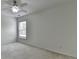 This bedroom features a ceiling fan, one window, and light colored walls at 3120 Caney Creek Ln, Cumming, GA 30041