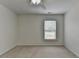 This bedroom features a ceiling fan, one window, and light colored walls at 3120 Caney Creek Ln, Cumming, GA 30041