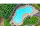 An aerial shot of the community pool showcases lounge chairs and a pool deck at 3120 Caney Creek Ln, Cumming, GA 30041