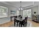Stylish dining room featuring chandelier lighting and bright windows at 3120 Caney Creek Ln, Cumming, GA 30041