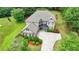 A charming two-story home with a well-manicured lawn, brick accents, and a spacious driveway at 3120 Caney Creek Ln, Cumming, GA 30041