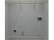 Functional laundry room features a wire shelf, plumbing fixtures, and electrical outlets for convenience at 3120 Caney Creek Ln, Cumming, GA 30041
