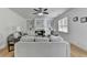 Inviting living room featuring modern decor, fireplace and bright, natural light at 3120 Caney Creek Ln, Cumming, GA 30041