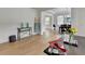 Open living space with wood floors, view of dining room, and modern decor at 3120 Caney Creek Ln, Cumming, GA 30041
