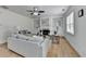 Cozy living room with a fireplace, built-in shelving, and hardwood floors at 3120 Caney Creek Ln, Cumming, GA 30041