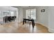 Inviting living area featuring a large window, wood floors, and a built-in study area at 3120 Caney Creek Ln, Cumming, GA 30041