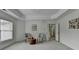 This spacious main bedroom features tray ceilings, two chairs, and light colored walls at 3120 Caney Creek Ln, Cumming, GA 30041