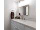 This bathroom features a marble countertop, a bronze faucet, and a modern mirror at 5860 Stoneleigh Dr, Suwanee, GA 30024