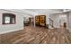 Finished basement with hardwood-style tile floor, stairs, and open living space at 5860 Stoneleigh Dr, Suwanee, GA 30024