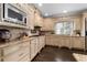 Beautiful kitchen featuring custom cabinets, granite countertops, and modern stainless steel appliances at 5860 Stoneleigh Dr, Suwanee, GA 30024