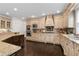 Spacious kitchen featuring custom cabinetry, granite countertops, and stainless steel appliances at 5860 Stoneleigh Dr, Suwanee, GA 30024