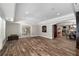 The spacious living room boasts hardwood floors, an open layout, and natural light from the windows at 5860 Stoneleigh Dr, Suwanee, GA 30024