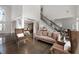 Inviting living room with soaring ceilings, and an open floor plan perfect for entertaining at 5860 Stoneleigh Dr, Suwanee, GA 30024