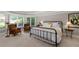 Relaxing bedroom suite features a sitting area with lots of natural light at 5860 Stoneleigh Dr, Suwanee, GA 30024