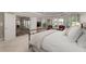The main bedroom is filled with natural light and adjoins a sitting area at 5860 Stoneleigh Dr, Suwanee, GA 30024