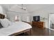 Spacious main bedroom with tray ceilings, ceiling fan, and ample natural light at 5860 Stoneleigh Dr, Suwanee, GA 30024