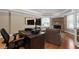 The office area includes a stone fireplace, hardwood floors, and custom cabinets at 5860 Stoneleigh Dr, Suwanee, GA 30024