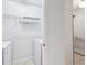 The laundry room is bright with a washer, dryer, and storage space at 2700 Pine Tree Ne Rd # 1208, Atlanta, GA 30324