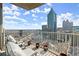 Relaxing balcony furnished with seating and decorative pots, boasting panoramic city views and skyline at 400 W Peachtree Nw St # 3611, Atlanta, GA 30308