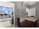 Contemporary bathroom featuring granite countertop, undermount sink, and floor to ceiling windows providing ample light at 400 W Peachtree Nw St # 3611, Atlanta, GA 30308