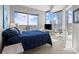 Well-lit bedroom with a large bed, TV, and sliding doors to a private balcony at 400 W Peachtree Nw St # 3611, Atlanta, GA 30308