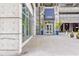Attractive building entrance featuring a covered walkway and landscaped planters at 400 W Peachtree Nw St # 3611, Atlanta, GA 30308