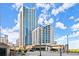 Exterior shot of the high-rise condominium building against a bright, cloudy sky at 400 W Peachtree Nw St # 3611, Atlanta, GA 30308