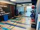 Bright community gym with exercise equipment, mats, and a mirrored wall at 400 W Peachtree Nw St # 3611, Atlanta, GA 30308