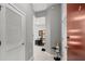 Hallway leading to the living spaces with gray walls and tile flooring at 400 W Peachtree Nw St # 3611, Atlanta, GA 30308