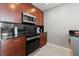 Gourmet kitchen featuring stainless steel appliances and dark subway tile backsplash at 400 W Peachtree Nw St # 3611, Atlanta, GA 30308