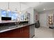 Modern kitchen features dark countertops, stainless steel appliances and city views at 400 W Peachtree Nw St # 3611, Atlanta, GA 30308