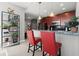 Open kitchen with bar seating and decorative shelving with plants at 400 W Peachtree Nw St # 3611, Atlanta, GA 30308