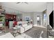 Well-lit living space featuring a modern sofa, elegant accents, and an inviting atmosphere with access to a balcony at 400 W Peachtree Nw St # 3611, Atlanta, GA 30308