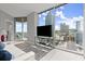 Bright living room with large windows showcasing city views, modern furnishings, and neutral tones at 400 W Peachtree Nw St # 3611, Atlanta, GA 30308