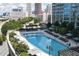 Aerial view of the community pool and amenities with city skyline in the background at 400 W Peachtree Nw St # 3611, Atlanta, GA 30308