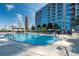 Modern community swimming pool with city views and comfortable lounge seating at 400 W Peachtree Nw St # 3611, Atlanta, GA 30308