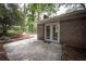 Charming brick home featuring double doors and a cozy entrance surrounded by lush greenery, offering a private and inviting entry at 5666 Goldfield Dr, Acworth, GA 30102