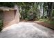 Concrete patio area and level backyard featuring mature trees at 5666 Goldfield Dr, Acworth, GA 30102