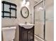 Bathroom featuring a toilet, dark vanity with sink, and shower with sliding doors at 5666 Goldfield Dr, Acworth, GA 30102