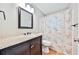Bathroom with a dark vanity, granite countertop, and a shower-tub combination at 5666 Goldfield Dr, Acworth, GA 30102