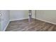 Bedroom featuring modern gray vinyl plank flooring, neutral paint and an exterior door at 5666 Goldfield Dr, Acworth, GA 30102