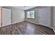 Bright bedroom with updated vinyl plank flooring, white trim and natural light at 5666 Goldfield Dr, Acworth, GA 30102