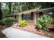 Charming brick ranch-style home with a welcoming green front door and mature landscaping at 5666 Goldfield Dr, Acworth, GA 30102