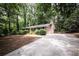 Well-kept brick house with a long driveway and natural landscaping at 5666 Goldfield Dr, Acworth, GA 30102