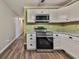 Updated kitchen with white cabinets, stainless appliances, and stylish granite countertops at 5666 Goldfield Dr, Acworth, GA 30102
