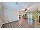 An open layout living room with wood-look flooring leads to the kitchen and outdoor patio at 5666 Goldfield Dr, Acworth, GA 30102